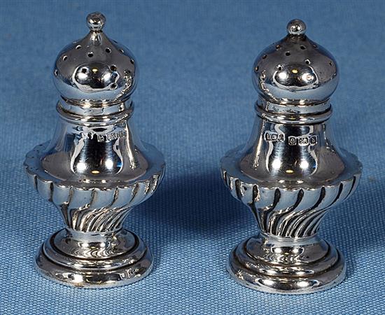 Three pairs of pepper casters.